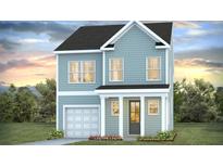 Charming two-story home with light blue siding and white trim, nestled in a landscaped yard at 127 Lilac Grove Way, Summerville, SC 29486