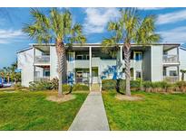 Charming condo with lush green lawn and mature palm trees at 1481 Center Street Ext # 302, Mount Pleasant, SC 29464