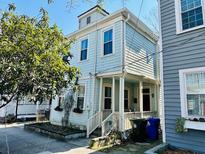 Charming two-story home with shingle siding and a welcoming front porch at 169 Fishburne St, Charleston, SC 29403