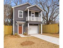 Charming two-story home with a gray exterior and a small front balcony at 2008 Emden St, North Charleston, SC 29406