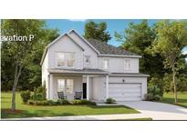 Charming two-story home with white siding, a covered porch, and well-manicured landscaping at 330 Pine Crest View Dr, Summerville, SC 29486
