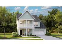 Charming two-story home with a welcoming front porch and attached garage offers comfort and style at 1020 Swamp Rose Run, Summerville, SC 29485