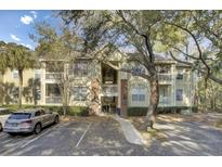 Exterior view of a multi-Gathering residential building with multiple balconies and parking at 1600 Long Grove Dr # 1727, Mount Pleasant, SC 29464