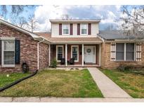 Charming two-story brick home with well-maintained lawn and inviting front porch at 4336 Purdue Dr, North Charleston, SC 29418