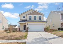 Charming two-story home with yellow siding, a well-manicured lawn, and a two-car garage at 505 Greywood Ln, Goose Creek, SC 29445