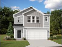 Charming two-story home features a classic design, landscaped front yard, and attached two-car garage at 744 Pisces Ln, Summerville, SC 29486