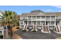 Charming multi-Gathering exterior showing individual entrances, balconies and well-manicured landscaping at 801 Balgrove Ct # 801, Mount Pleasant, SC 29466