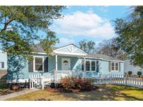Charming light blue house with a white picket fence and well-maintained front yard at 1079 Lockhart St, North Charleston, SC 29405