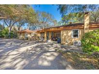 Spacious home exterior featuring a covered patio and ample parking at 29 Wendy Lane, Charleston, SC 29407