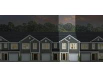 Modern townhome showcasing well-maintained exterior and individual garages, under a twilight sky at 539 Golden Embers Way, Summerville, SC 29486