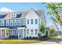 Charming two-story townhomes with blue and white siding and inviting front porches on a sunny day at 758 Blueway Ave, Summerville, SC 29486