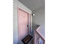 Inviting front door with a welcome mat and charming entryway at 7955 Timbercreek Ln # 1807, North Charleston, SC 29418