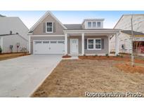 Charming single-Gathering home with a two-car garage and manicured front yard at 1056 Marsh Harrier Dr # Cc3-15-6P, Ravenel, SC 29470
