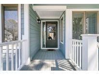Charming covered front porch with gray door and white railings at 1715 Greystone Blvd Blvd # 25, Mount Pleasant, SC 29464