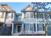 Inviting townhome exterior with neutral siding, black shutters, and well-maintained landscaping at 3049 Park West Blvd, Mount Pleasant, SC 29466