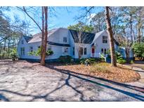 Charming two-story home with a red front door and covered front porch at 4333 Cloudmont Dr, Hollywood, SC 29449