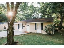 Charming single-story home with a well-maintained lawn and mature trees, enhancing its curb appeal at 1137 Dickson Ave, Hanahan, SC 29410