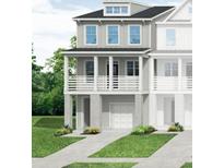 Charming home with covered porch, multiple windows, and an attached garage in a well-maintained community at 406 Katies Scenic Ct, Charleston, SC 29492