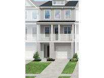 Charming two-story home with a covered front porch and an attached garage at 408 Katies Scenic Ct, Charleston, SC 29492