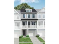 Charming three-story home featuring a front porch, garage, and a well-maintained lawn at 412 Katies Scenic Ct, Charleston, SC 29492