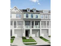 Charming two-story townhouse with a porch, garage, and manicured lawn at 414 Katies Scenic Ct, Charleston, SC 29492