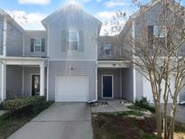 Charming townhome with an attached one-car garage and well-maintained landscaping at 510 Truman Dr, Goose Creek, SC 29445
