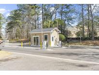 Community guard house for gated neighborhood with gate access, ensuring privacy and security at 7932 Riverbirch Ln, North Charleston, SC 29418