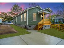 Charming home with a cozy front porch and newly landscaped yard at 2647 Tillman St, North Charleston, SC 29405