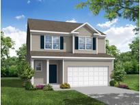 Charming two-story home with a well-manicured lawn, beautiful landscaping, and a two car garage at 359 Blue Oak Dr, Moncks Corner, SC 29461