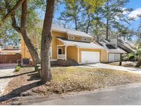 Charming two-story home with attached two car garage and mature landscaping in a quiet neighborhood at 104 Broadmarsh Ct, North Charleston, SC 29418