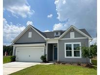Charming one-story home with gray siding, a two-car garage, and a well-manicured front yard at 1001 Middleton Dr Dr, Goose Creek, SC 29445