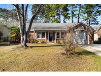 Charming brick home with a well-manicured lawn and mature trees in a desirable neighborhood at 110 Ruffin Rd, Summerville, SC 29486