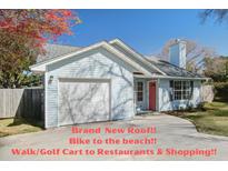 Charming single-story home featuring an attached garage, well-kept lawn, and a new roof at 2058 Willowdale Ct, Mount Pleasant, SC 29466