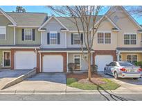 Charming townhome featuring an attached garage, neutral paint, and well-maintained landscaping at 234 Darcy Ave, Goose Creek, SC 29445