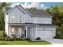 Charming two-story home with light blue siding, an attached garage, and a well-manicured lawn and landscaping at 550 Richfield Way, Summerville, SC 29486