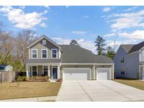 Charming two-story home with a well-manicured lawn and a two-car garage in a desirable neighborhood at 808 S Pointe Blvd, Summerville, SC 29483