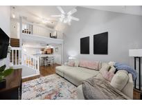 Bright living room with high ceilings, open floor plan and cozy sectional sofa at 8618 Grassy Oak Trl, North Charleston, SC 29420