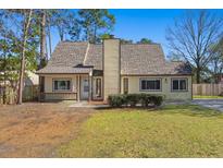 Charming single-Gathering home with a well-maintained lawn and inviting entrance at 100 Traders Station Rd, Summerville, SC 29486