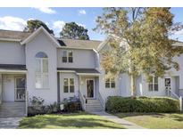 Charming two-story townhome with neutral siding and well-manicured landscaping at 1263 Marshview Dr, Charleston, SC 29412