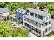 Stunning aerial view of a Charleston-style home with a manicured backyard and charming two-story design at 5 Alexander St, Charleston, SC 29401