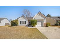 Charming single-story home with white siding, attached garage, and well-manicured front yard at 103 Old Tree Rd, Goose Creek, SC 29445
