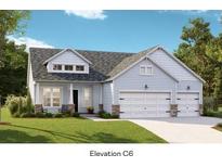 Charming single-story home featuring light blue siding, stone accents, and a convenient two-car garage at 1146 Darling St, Summerville, SC 29485