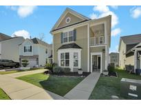 Beautiful two-story home with well-maintained lawn and detached garage at 2333 Town Woods Rd, Charleston, SC 29414