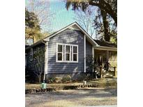 Charming home with gray siding, white trim, large windows, and a screened-in porch at 236 Ellen Reid Ln, Summerville, SC 29485