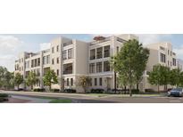 A charming multi-story townhome features balconies and black window frames, blending modern design with comfortable living at 317 Longshore St # 317, Charleston, SC 29492