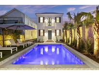 Stunning pool and backyard with palm trees at twilight at 34 Percy St, Charleston, SC 29403