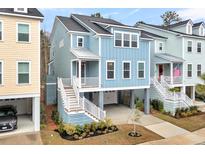 Charming elevated beach home with HardiePlank siding, white railings, and convenient garage parking at 3726 Apiary Ln, Johns Island, SC 29455