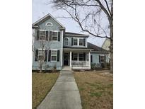 Charming two-story home with a welcoming front porch and well-maintained landscaping at 414 Hamlet Cir, Goose Creek, SC 29445