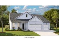 Charming single-Gathering home with a two-car garage, a welcoming front porch, and manicured landscaping at 1156 Darling St, Summerville, SC 29485