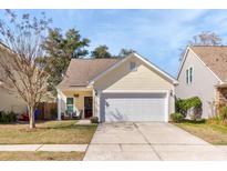 Charming single-story home with a two-car garage and well-maintained front yard at 1516 Oldenburg Dr, Mount Pleasant, SC 29466